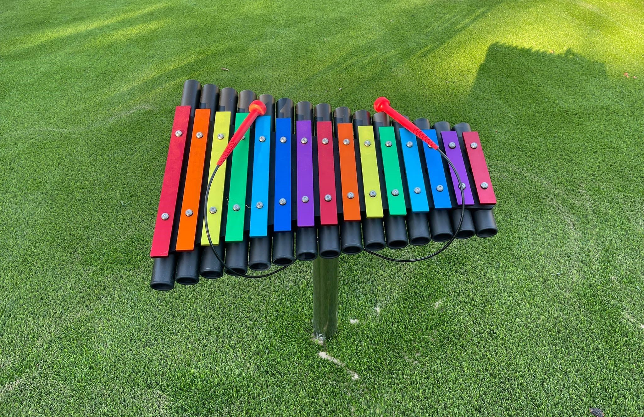 Outdoor musical instrument installed in grass
